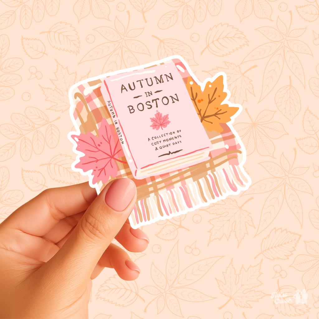 Sticker Autumn in Boston, livre posé sur un plaid avec des feuilles d'érable