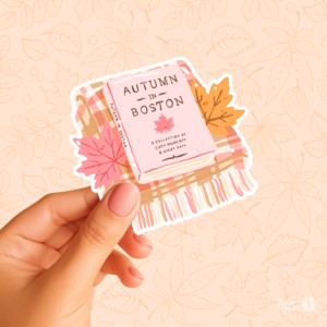 Sticker Autumn in Boston, livre posé sur un plaid avec des feuilles d'érable